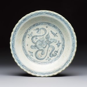 An unusual Chinese blue and white celadon-back 'Buddhist Lion' plate, Ming — photo 1