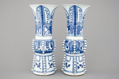 An unusual pair of tall Chinese blue and white porcelain gu-shaped vases, Kangxi, ca. 1700