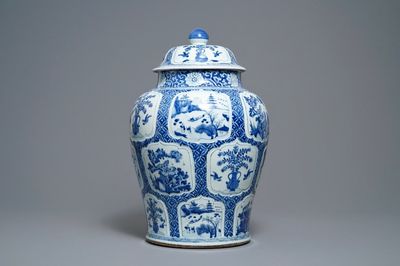 Een Chinese blauw-witte dekselvaas met bloemen en landschappen, Kangxi