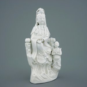 Een Chinese Dehua blanc de Chine figuur van Guanyin met kind, 18/19e eeuw — foto 1