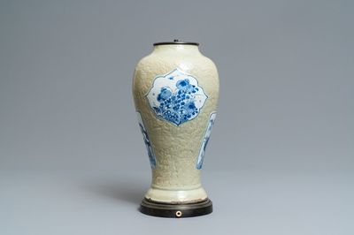 Een Chinese vaas met blauw-wit decor op sgraffito celadon fondkleur, Kangxi