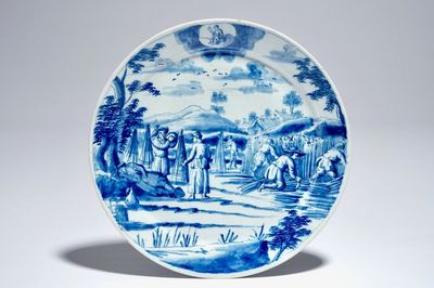 Een Delfts blauw-wit bord met landarbeiders uit de reeks "Sterrenbeelden", vroeg 18e eeuw