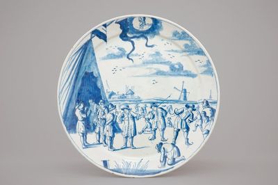 Een Delfts bord met schaatsers op het ijs, uit de reeks "Sterrenbeelden", vroeg 18e eeuw
