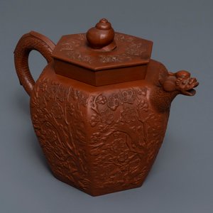 Een grote Chinese Yixing steengoed theepot met reliëfdecor, Kangxi — foto 1