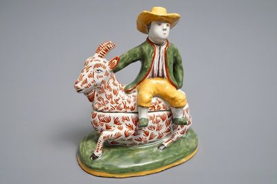 Een polychrome botervloot in de vorm van een bokkenrijder in Delftse stijl, wellicht Dèsvres, Frankrijk, ca. 1900
