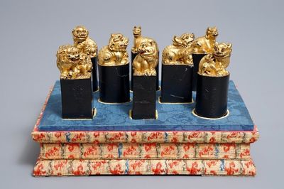 Eight Chinese parcel-gilt ink stones shaped as seals in display box, 18/19th C.