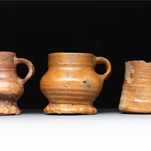 Eight stoneware jugs and mugs, and a glazed pottery vessel, Germany and The Netherlands, 16/17th C. — photo 20
