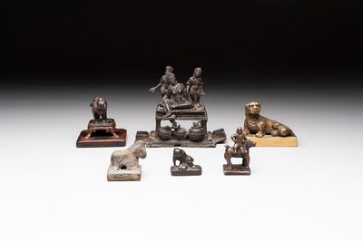 Five Chinese bronze seals and an Indonesian bronze figure group, 18/19th C.