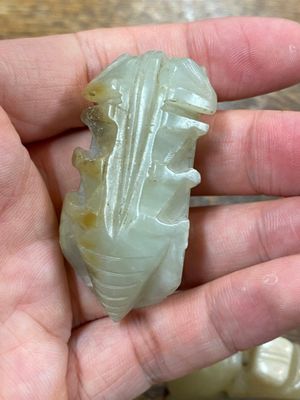 Five Chinese celadon and russet jade carvings, 19th C. — photo 23