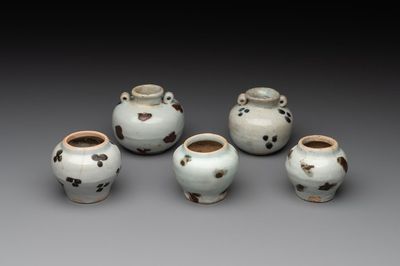 Five Chinese russet-splashed Longquan celadon jarlets, Song/Yuan