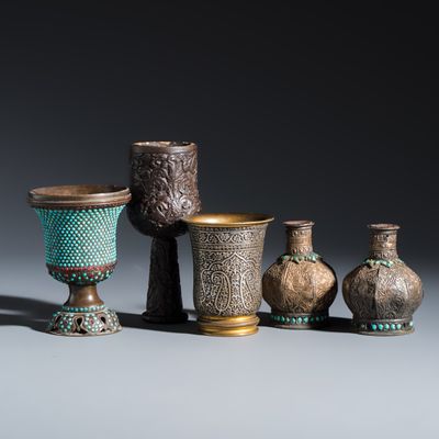 Five Persian repoussé, inlaid and turquoise-set metal hookah components, Qajar, 19th C.