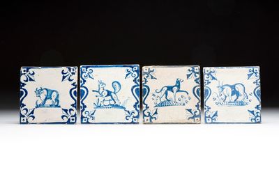 Four blue and white Dutch Delft 'candelabra' tiles with animals, 17th C.