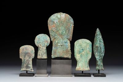 Four Chinese and Vietnamese bronze axes and an arrowhead, Western Zhou/Dong Son