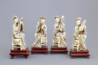 Four Chinese carved ivory ladies with instruments on wooden stands, ca. 1900
