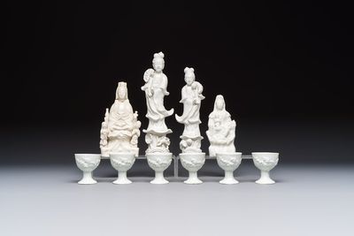 Four Chinese Dehua blanc de Chine figures of Guanyin and six wine cups, Kangxi and later