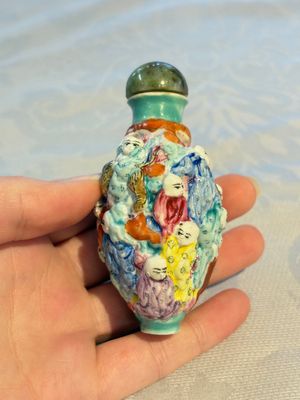 Four Chinese famille rose moulded 'Luohan' snuff bottles, Qianlong marks, 19th C. — photo 12