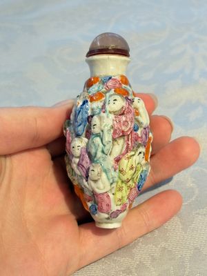 Four Chinese famille rose moulded 'Luohan' snuff bottles, Qianlong marks, 19th C. — photo 17