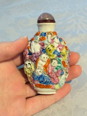 Four Chinese famille rose moulded 'Luohan' snuff bottles, Qianlong marks, 19th C. — photo 18