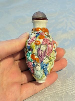 Four Chinese famille rose moulded 'Luohan' snuff bottles, Qianlong marks, 19th C. — photo 19