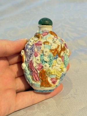 Four Chinese famille rose moulded 'Luohan' snuff bottles, Qianlong marks, 19th C. — photo 26