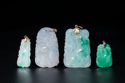 Four Chinese jadeite pendants with gold and silver mounts, 19/20th C.