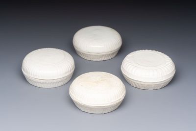 Four Chinese white-glazed boxes and covers with incised floral design from the Jepara shipwreck, Dehua or Anxi kiln, Song