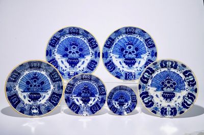 Four Dutch Delft blue and white chargers and two plates with "Peacock's tail" pattern, 18th C.