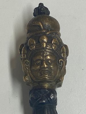 Four Tibetan bronze and wooden phurbas, a 'kapala' or skull-bowl, a pair of brass tingsha and two silver ornaments,  19th C. — photo 19