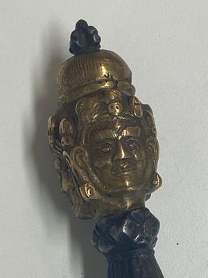 Four Tibetan bronze and wooden phurbas, a 'kapala' or skull-bowl, a pair of brass tingsha and two silver ornaments,  19th C. — photo 21