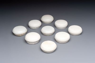 Nine Chinese white-glazed boxes and covers with incised floral design from the Jepara shipwreck, Dehua or Anxi kiln, Song
