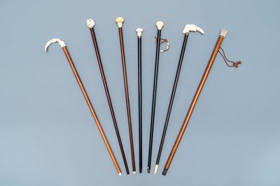 Seven ivory-handled canes, one with freemasonry emblem, 19th C.
