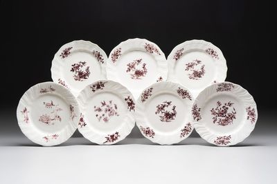 Seven manganese Tournai porcelain plates with floral design, 18th C.