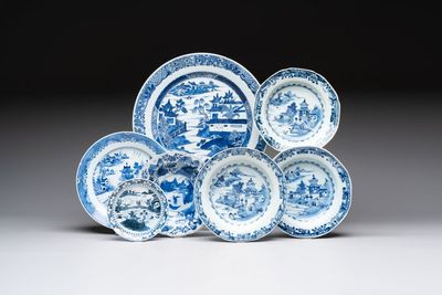 Six Chinese blue and white plates and a dish with landscape design, 18th C.
