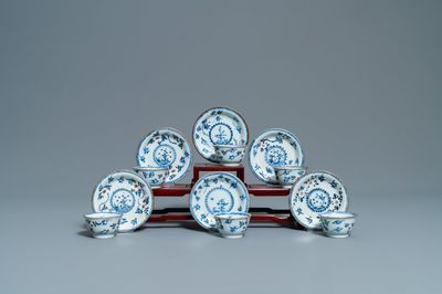 Six Chinese blue, white and copper-red cups and saucers, Kangxi