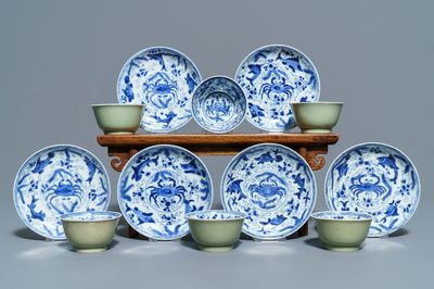 Six Chinese celadon and blue and white 'crabs and fish' cups and saucers, Kangxi