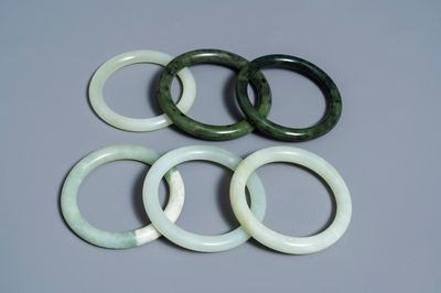 Six Chinese celadon and spinach green jade bangles, 19/20th C.