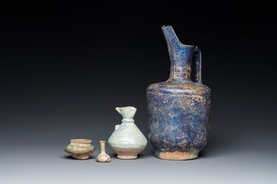 Three blue- and turquoise-glazed Islamic pottery wares and a glass bottle, Kashan and Raqqa, 12th C. and later