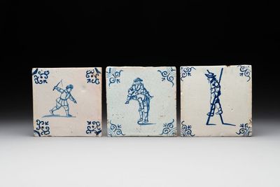 Three blue and white Dutch Delft tiles with children's games, 17th C.