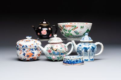 Three Chinese blue and white, famille rose and black-glazed covered teapots, a salt, an Imari-style covered bowl, and a famille verte bowl, 18th C.
