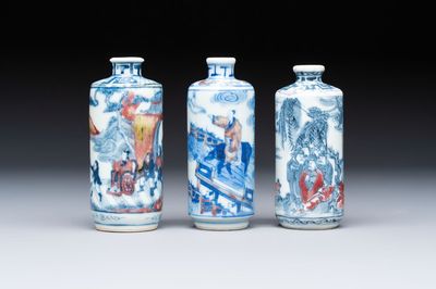Three Chinese blue, white and copper-red snuff bottles, 19th C.