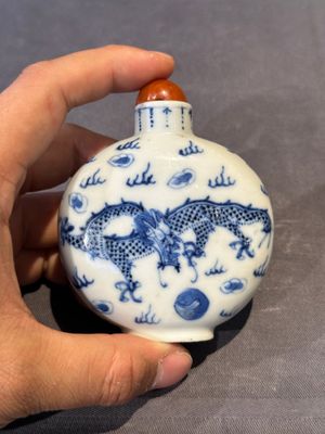 Three Chinese blue, white and copper-red snuff bottles and a blue and white snuff bottle, Qianlong mark, 19th C. — photo 2