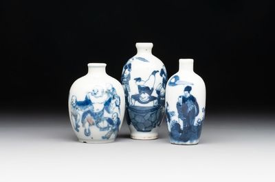 Three Chinese blue, white and copper-red snuff bottles with figural design, Yongzheng and Qianlong mark, 19th C.