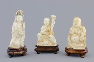 Three Chinese carved ivory figures on wooden stands, ca. 1900