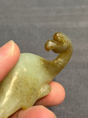 Three Chinese celadon and russet jade carvings of animals, 19th C. — photo 24