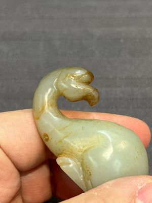 Three Chinese celadon and russet jade carvings of animals, 19th C. — photo 25