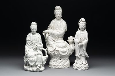 Three Chinese Dehua blanc de Chine figures of Guanyin, 20th C.