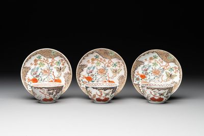 Three Chinese famille rose 'flowers and butterflies' cups and saucers, Yongzheng