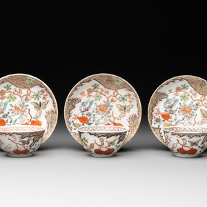 Three Chinese famille rose 'flowers and butterflies' cups and saucers, Yongzheng — photo 1