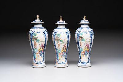 Three Chinese famille rose 'mandarin subject' vases and covers, Qianlong