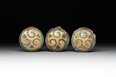 Three Chinese gilt-bronze ornaments with 'thunder' design, Han